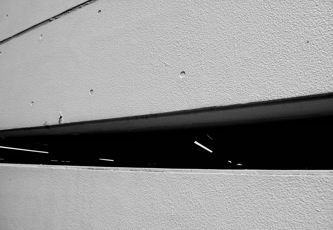 black metal bar on white wall