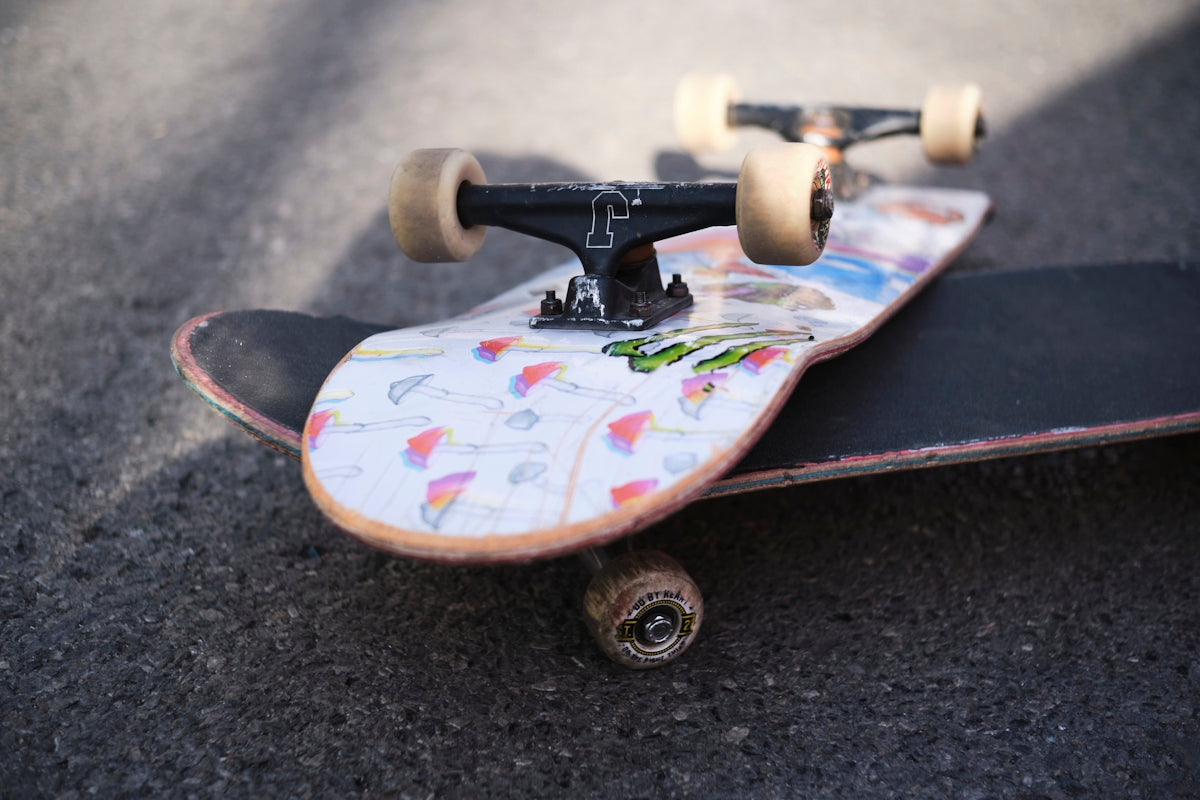 a close up of a skateboard on the ground